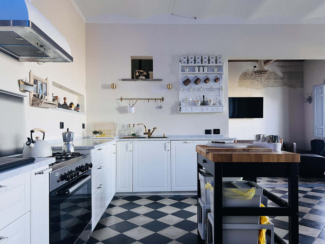 Kitchen of Villa Betula with black and white tiled floor