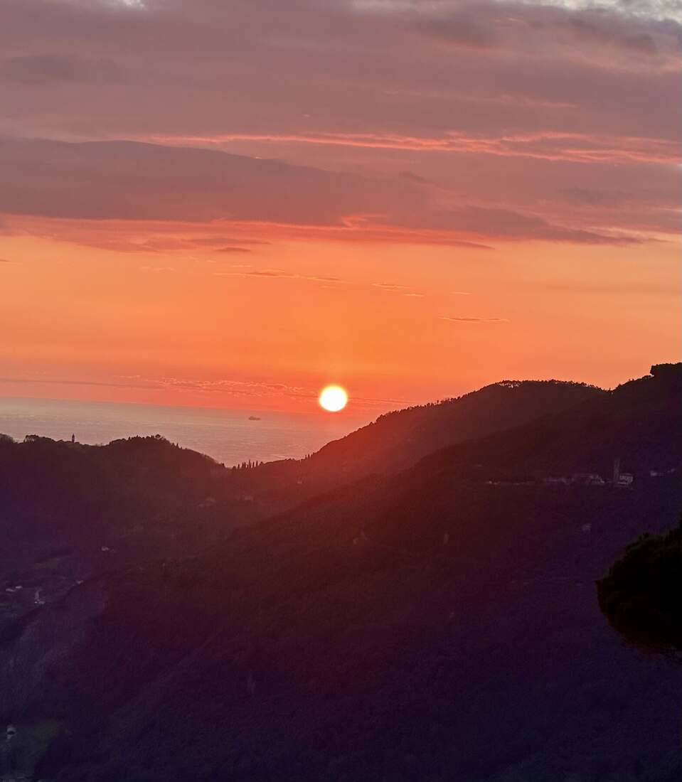 Sunset over the sea from the mountains